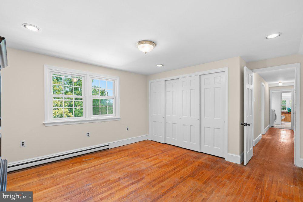 201 East Moyer Road Pottstown, PA 19464 - Photo 28 of 64 an empty room with wooden floor and windows
