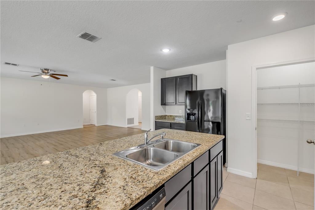 48 Hickory Loop Ocala, FL 34472 - Photo 19 of 52 a kitchen that has a sink and cabinets