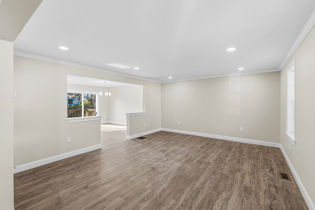 1001 Bay Street Fall River, MA 02724 - Photo 13 of 37 a view of an empty room with wooden floor and a window