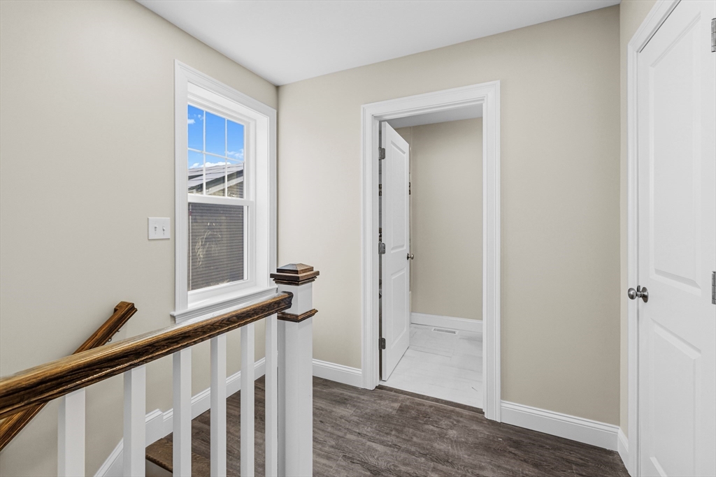 1001 Bay Street Fall River, MA 02724 - Photo 18 of 37 a view of a hallway with wooden floor and staircase
