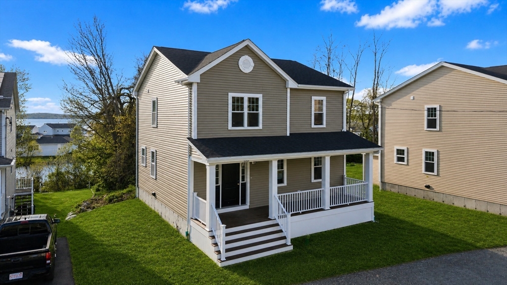 1001 Bay Street Fall River, MA 02724 - Photo 2 of 37 a front view of a house with a yard
