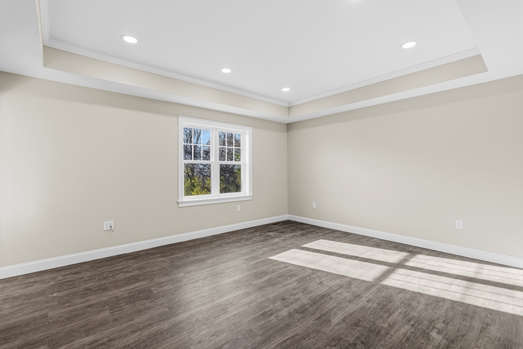 1001 Bay Street Fall River, MA 02724 - Photo 22 of 37 a view of an empty room with a window and wooden floor