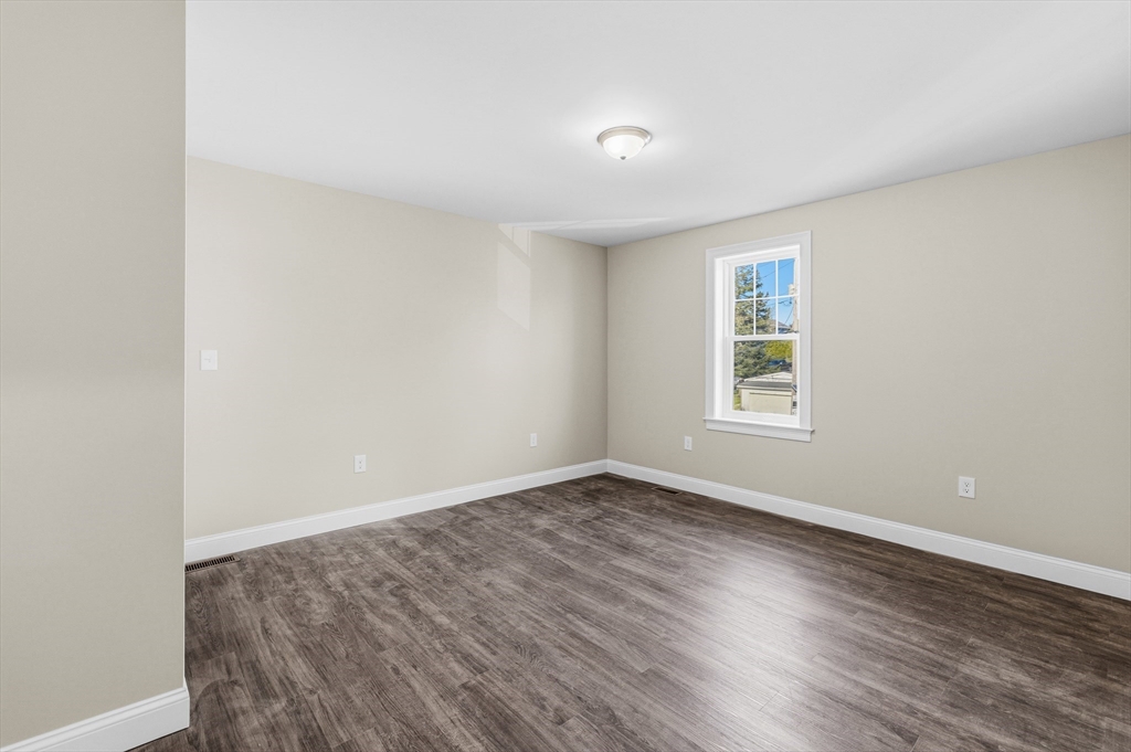 1001 Bay Street Fall River, MA 02724 - Photo 26 of 37 an empty room with wooden floor and windows