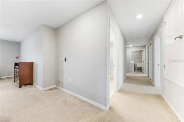 a dining room with stainless steel appliances kitchen island a table and chairs