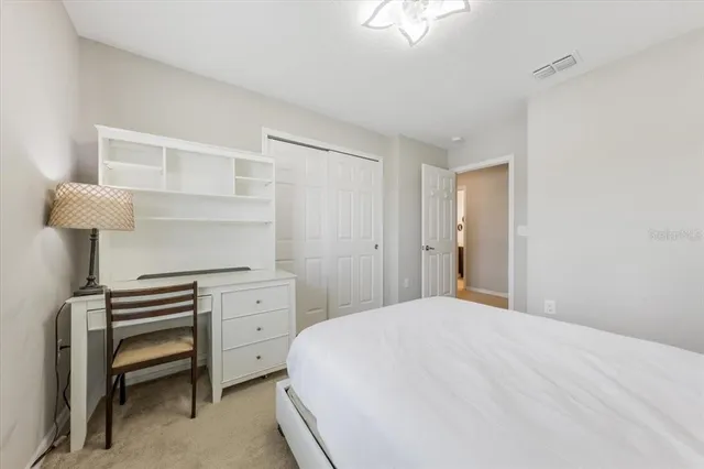 a bathroom with a double vanity sink mirror and shower