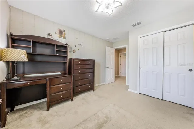 a view of hallway with furniture and a window