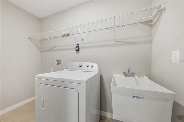 a bathroom with a double vanity sink mirror and toilet
