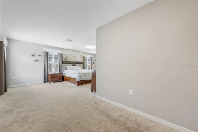 a kitchen with a stove and white cabinets