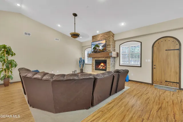 a view of a dining room with furniture and chandelier