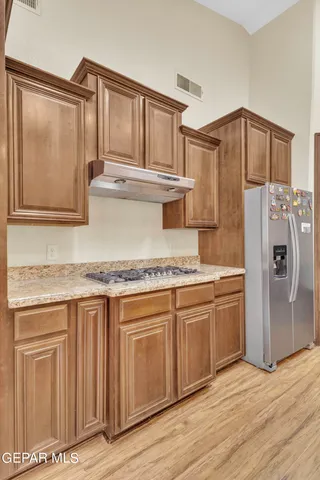 a living room with furniture ceiling fan and a window