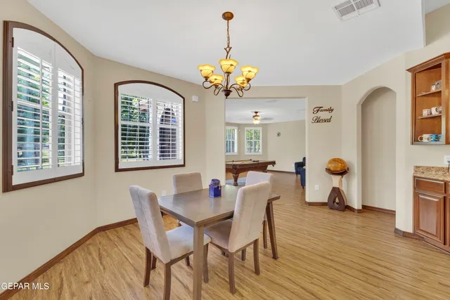 a living room with furniture gym equipment and a window