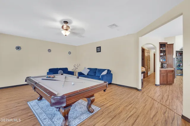 a living room with a rug and a couch