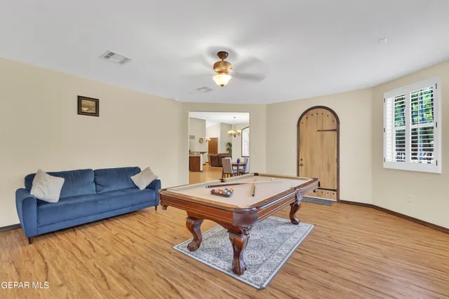 a en suite bathroom with a granite countertop double vanity sink mirror and shower