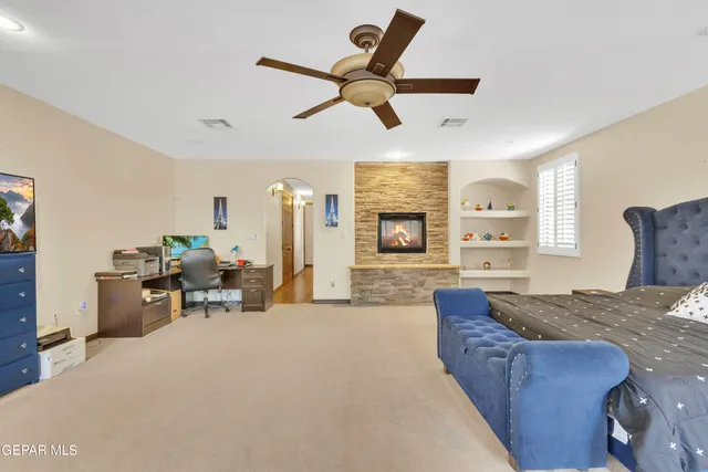 a bedroom with a bed and a dresser in it