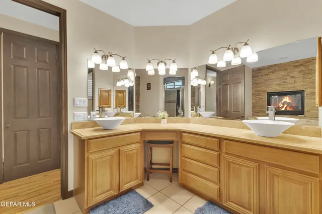 an aerial view of residential house with outdoor space and trees all around