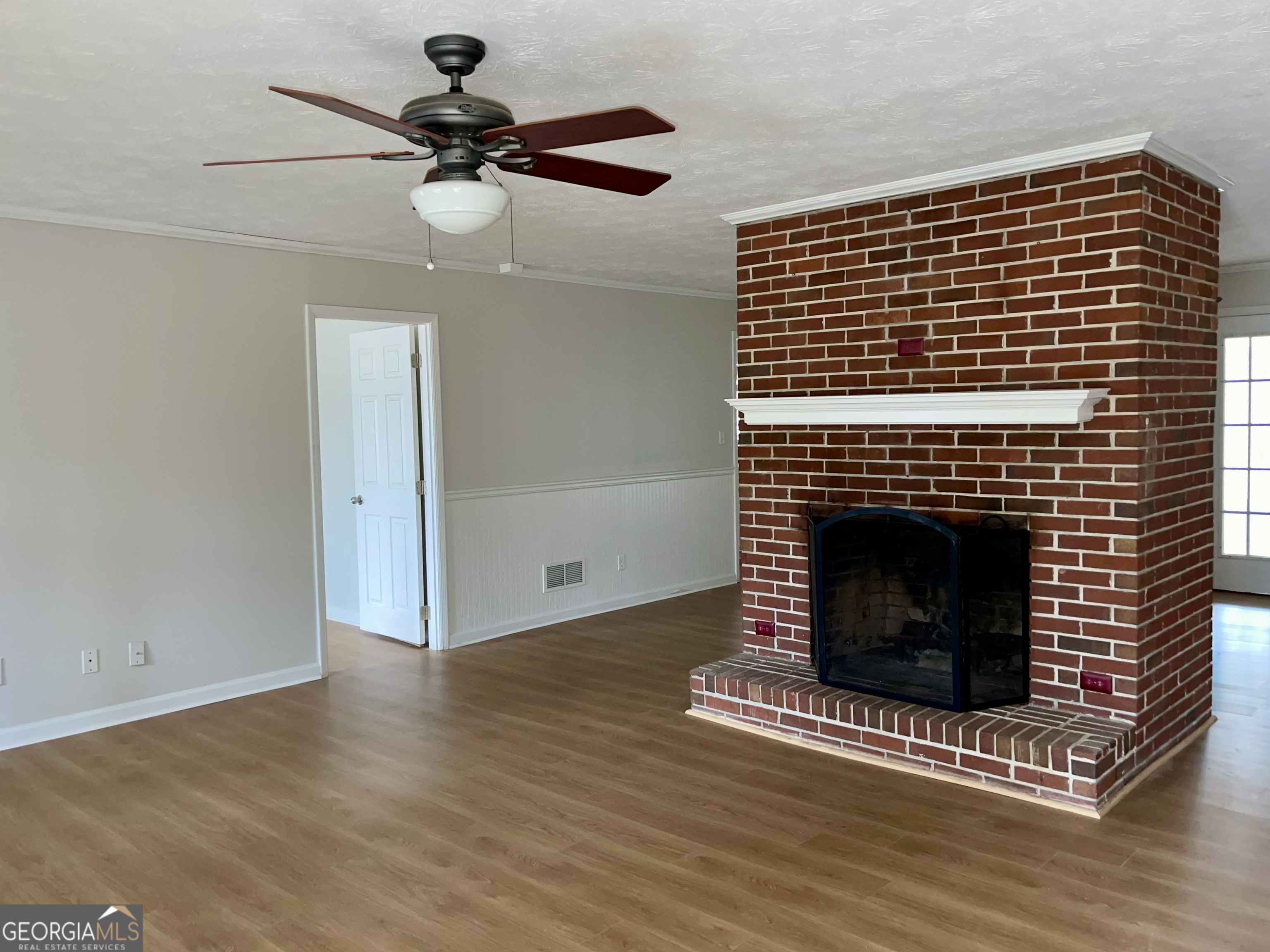 764 Hemphill Road Stockbridge, GA 30281 - Photo 3 of 14 a view of fireplace and wooden floor