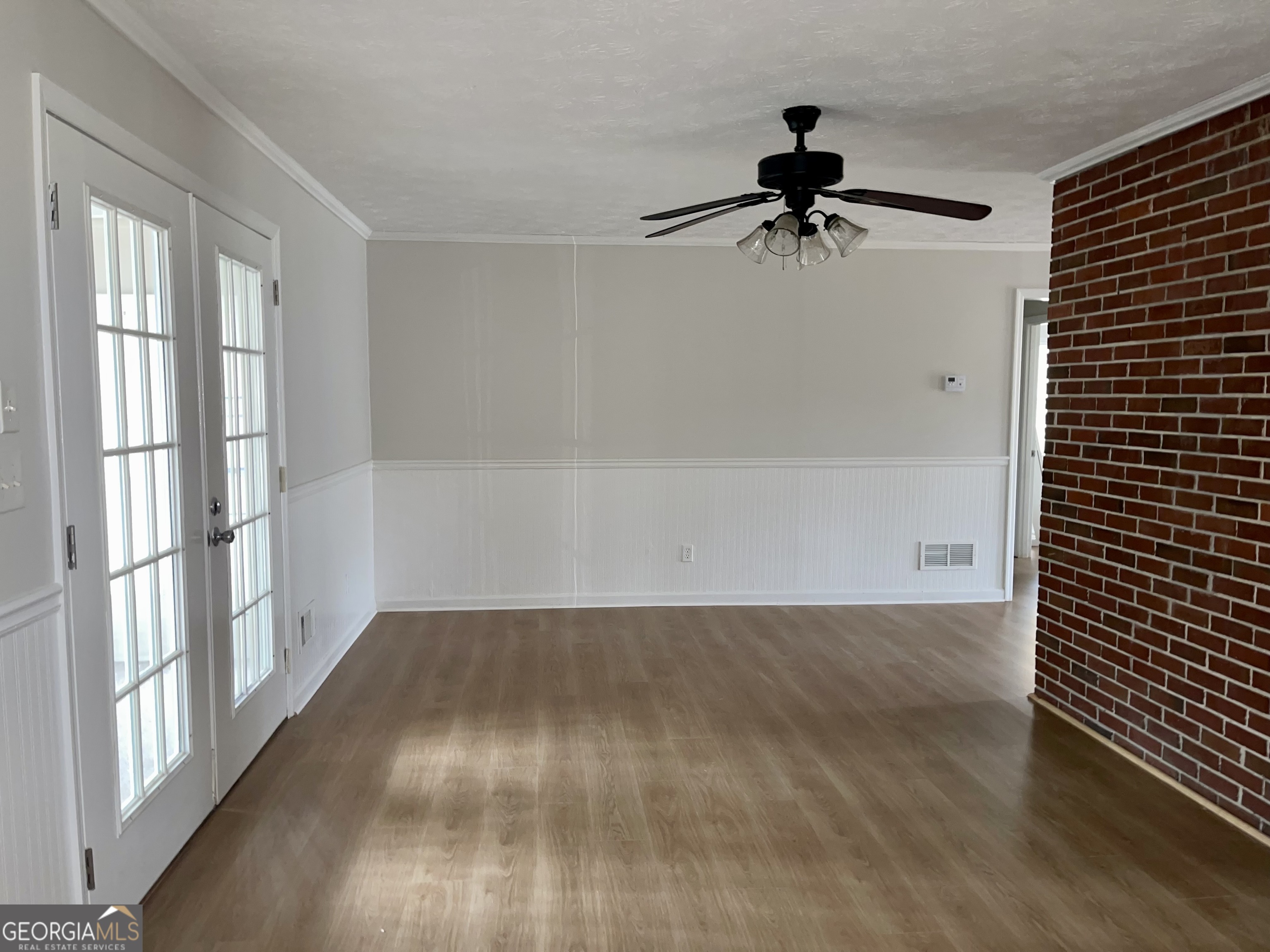 764 Hemphill Road Stockbridge, GA 30281 - Photo 4 of 14 wooden floor in an empty room with a window