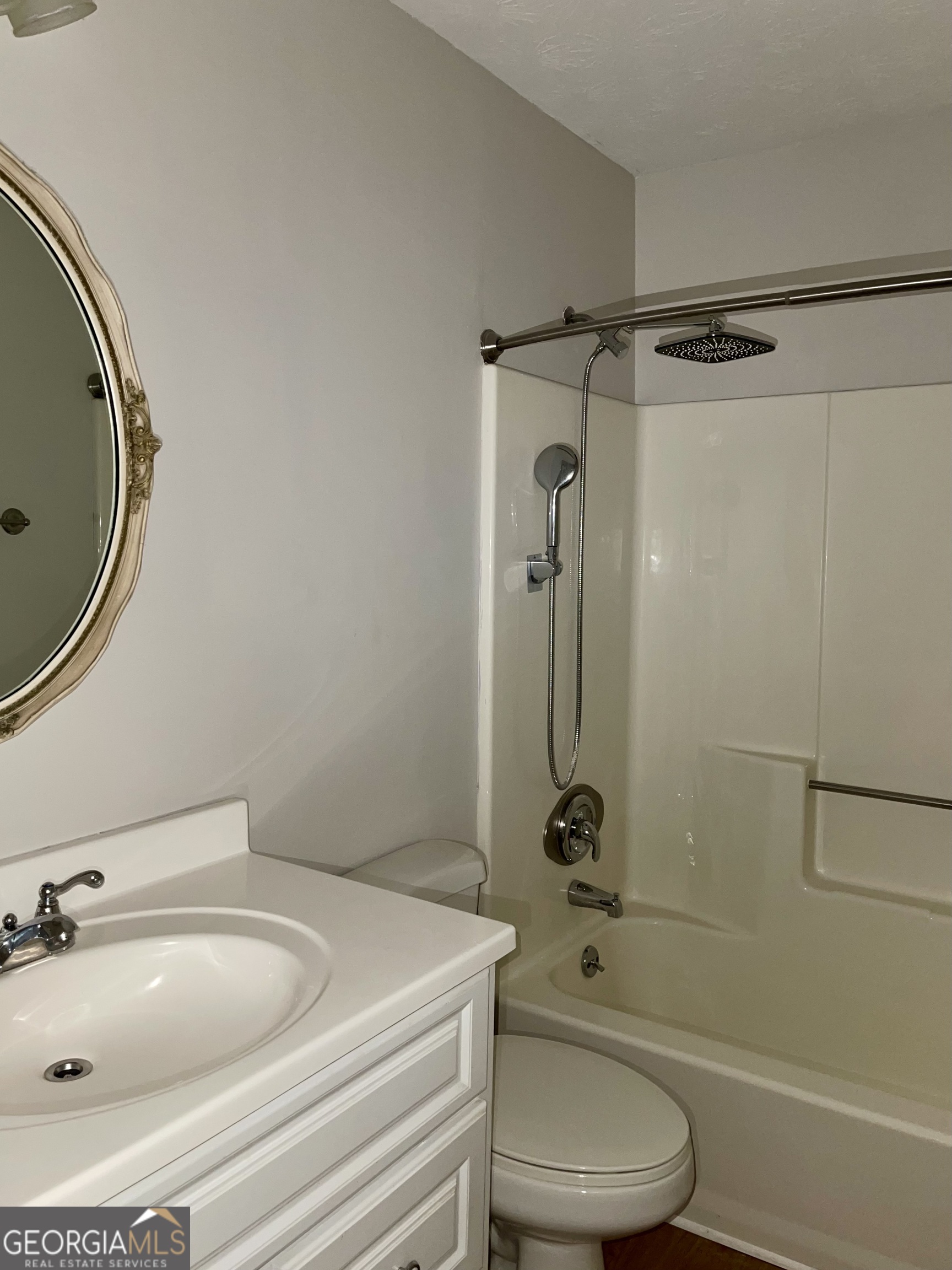 764 Hemphill Road Stockbridge, GA 30281 - Photo 10 of 14 a bathroom with a sink a toilet and shower