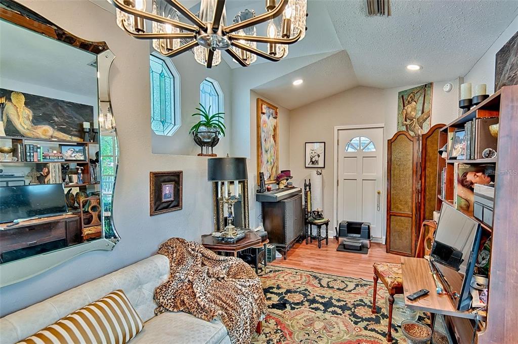 360 Southeast Lakeview Drive Keystone Heights, FL 32656 - Photo 3 of 17 a bedroom with furniture and a fireplace