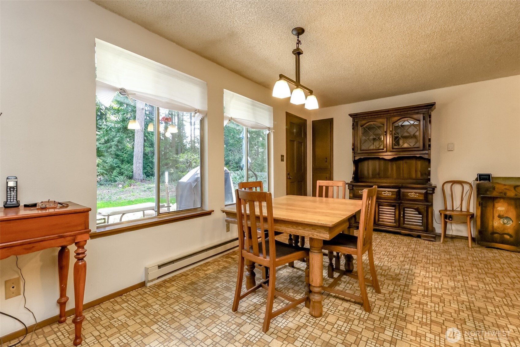 4701 292nd Street East Graham, WA 98338 - Photo 14 of 40 a view of a dining room with furniture window and outside view
