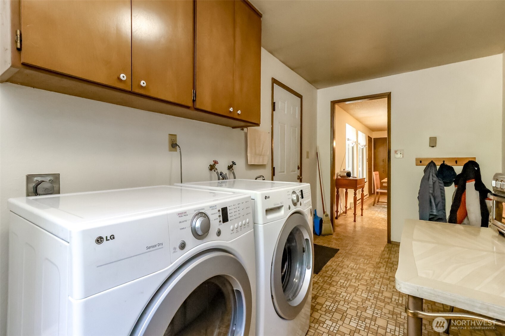 4701 292nd Street East Graham, WA 98338 - Photo 17 of 40 a view of hallway with washer and dryer