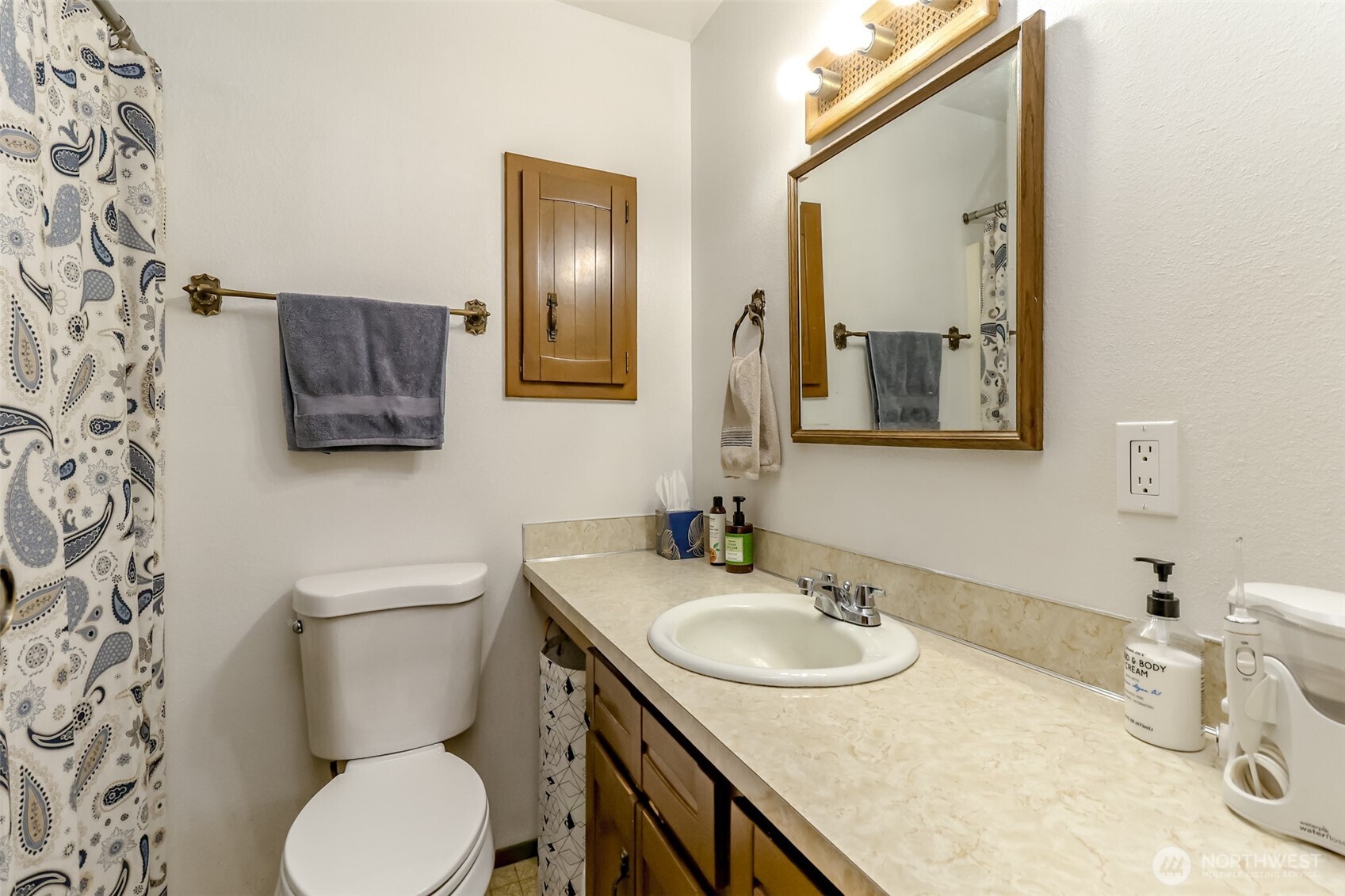 4701 292nd Street East Graham, WA 98338 - Photo 18 of 40 a bathroom with a granite countertop toilet sink and mirror