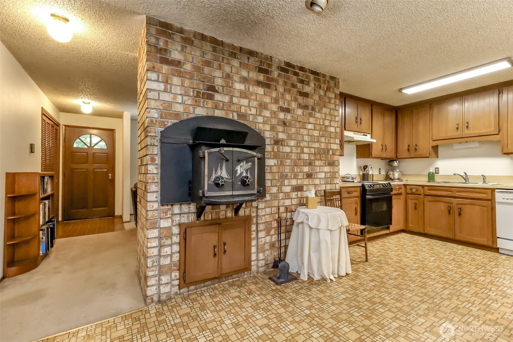 4701 292nd Street East Graham, WA 98338 - Photo 2 of 40 a kitchen with a stove a sink and a refrigerator