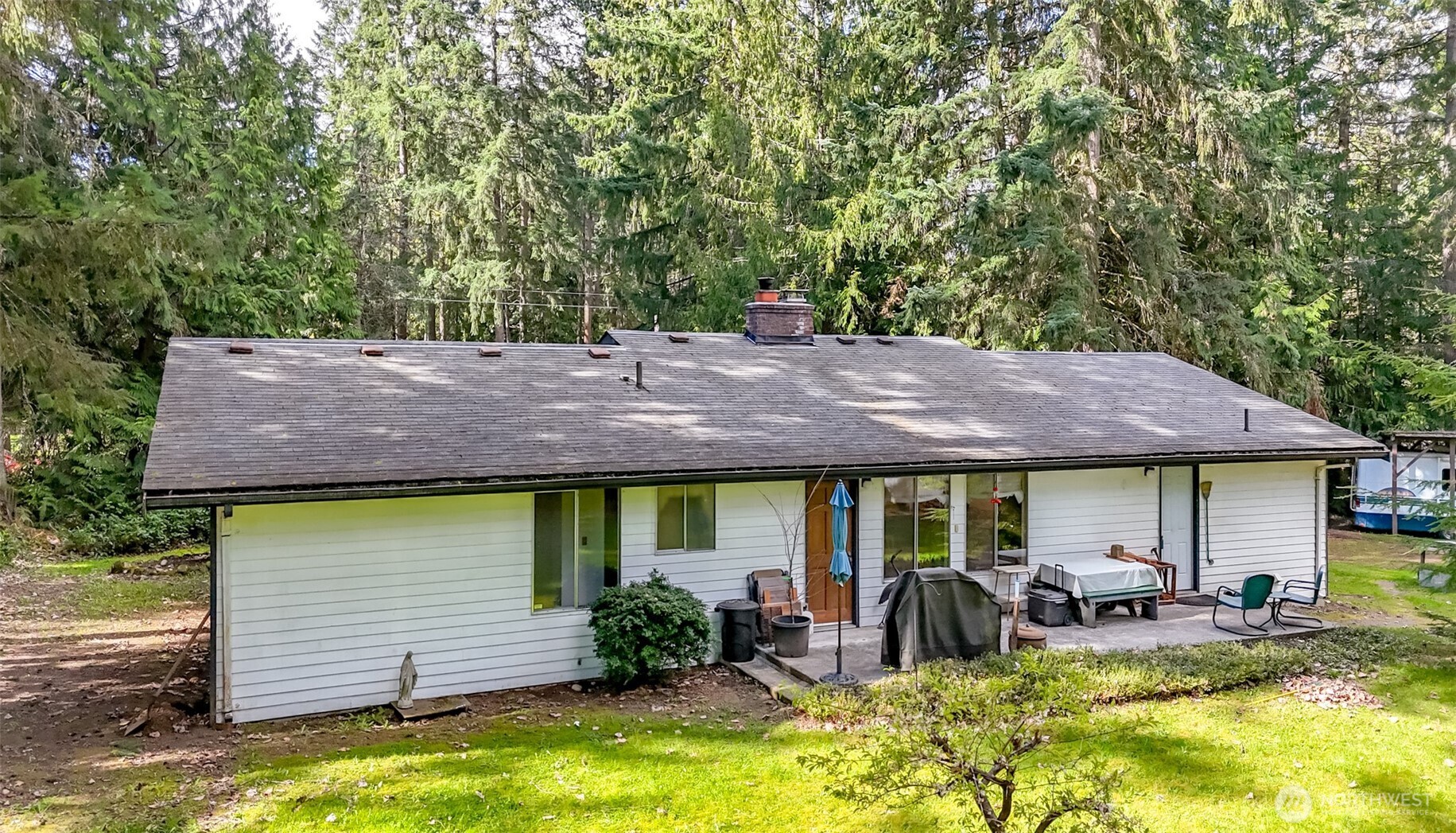4701 292nd Street East Graham, WA 98338 - Photo 27 of 40 a view of house with swimming pool and furniture