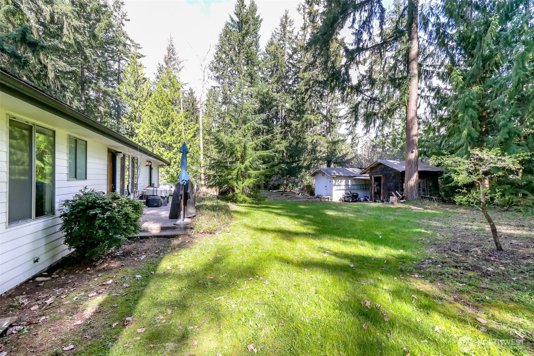 4701 292nd Street East Graham, WA 98338 - Photo 31 of 40 a front view of a house with garden