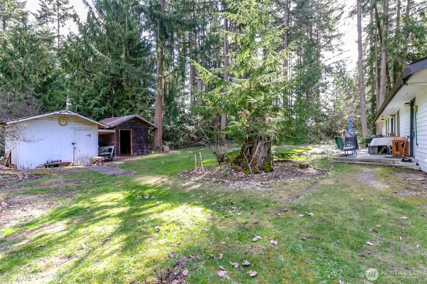 4701 292nd Street East Graham, WA 98338 - Photo 32 of 40 a front view of a house with garden