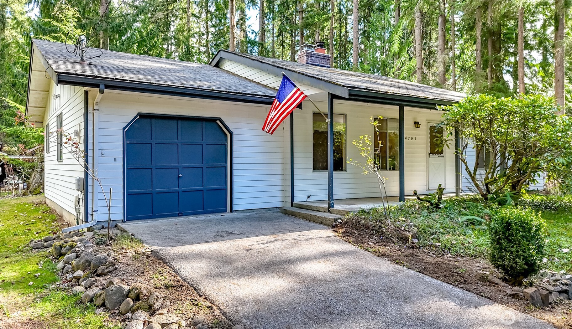 4701 292nd Street East Graham, WA 98338 - Photo 5 of 40 a front view of a house with a yard