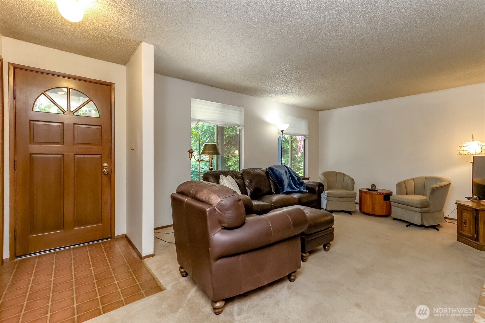 4701 292nd Street East Graham, WA 98338 - Photo 8 of 40 a living room with furniture and a window