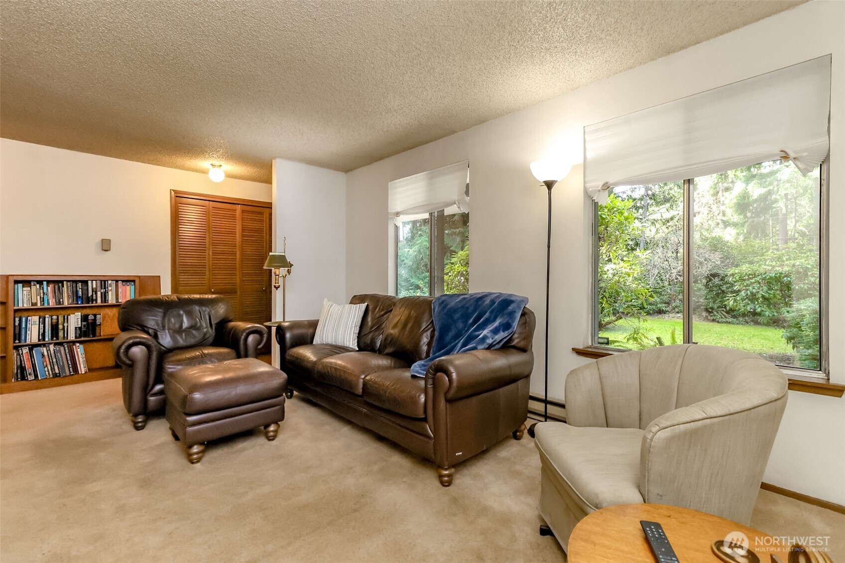 4701 292nd Street East Graham, WA 98338 - Photo 9 of 40 a living room with furniture and a large window