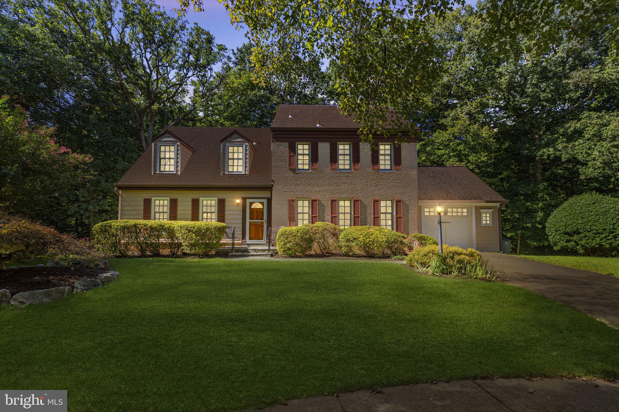 5 Columbia Court Rockville, MD 20850 - Photo 1 of 68 a front view of a house with a garden