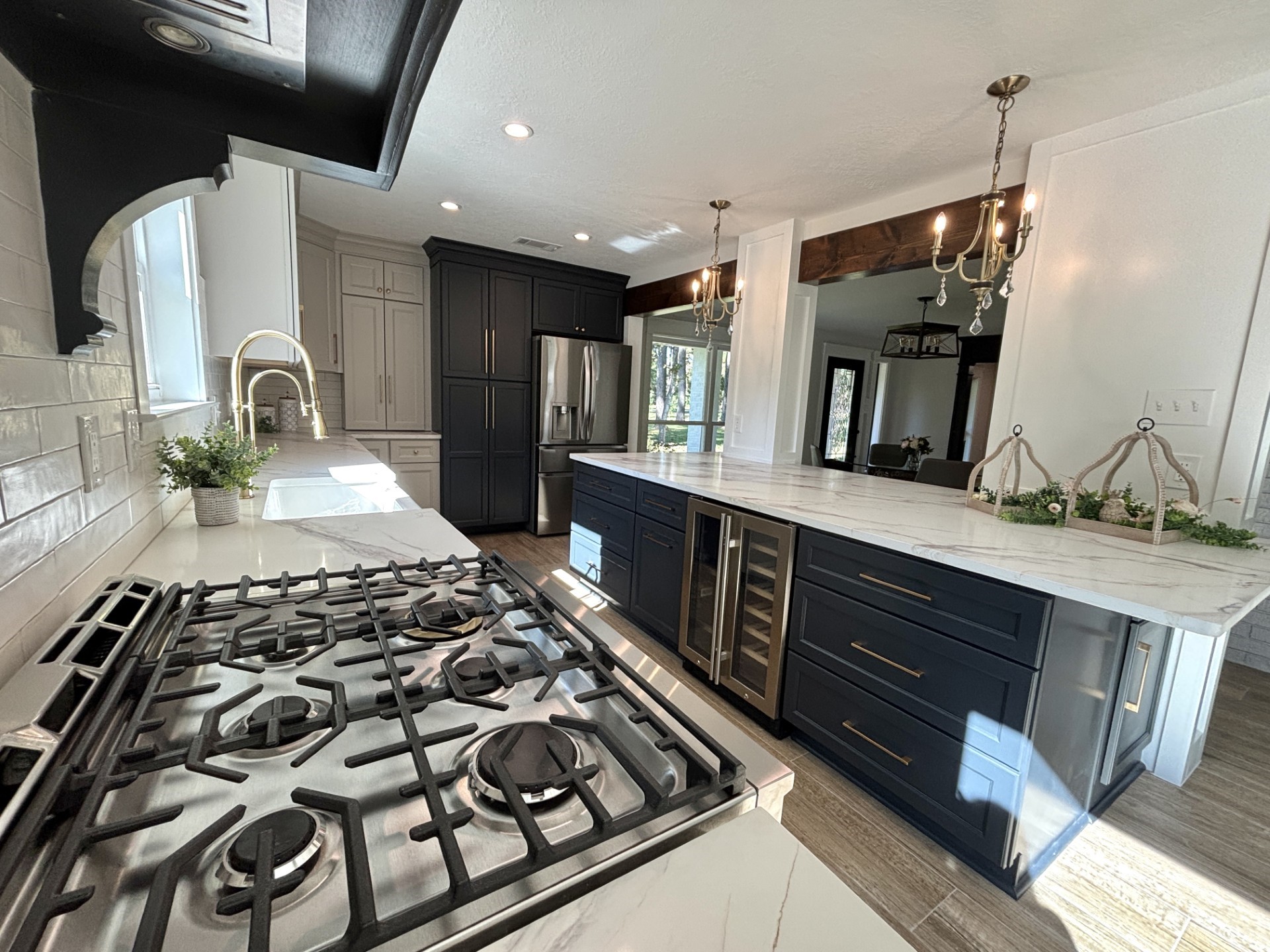 211 Garden West Conroe, TX 77304 - Photo 16 of 35 The oversized island is an ideal location for catering or setting up your buffet line for guests. Bar stools can be added to the side and front (seats 4). Notice the 6-burner gas range (Frigidaire Professional)