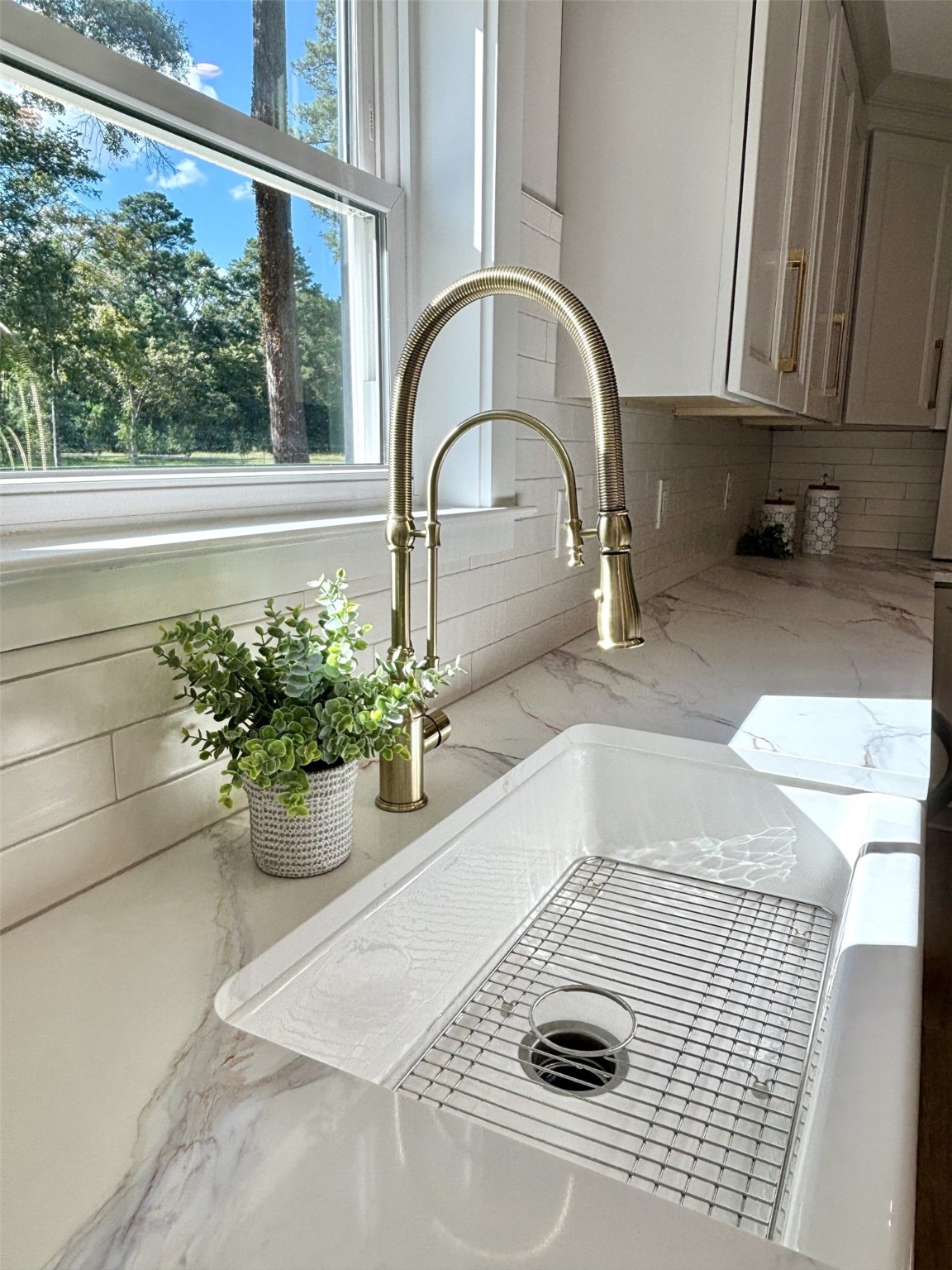 211 Garden West Conroe, TX 77304 - Photo 17 of 35 Look at this lovely kitchen faucet with pull down sprayer and cast iron sink!