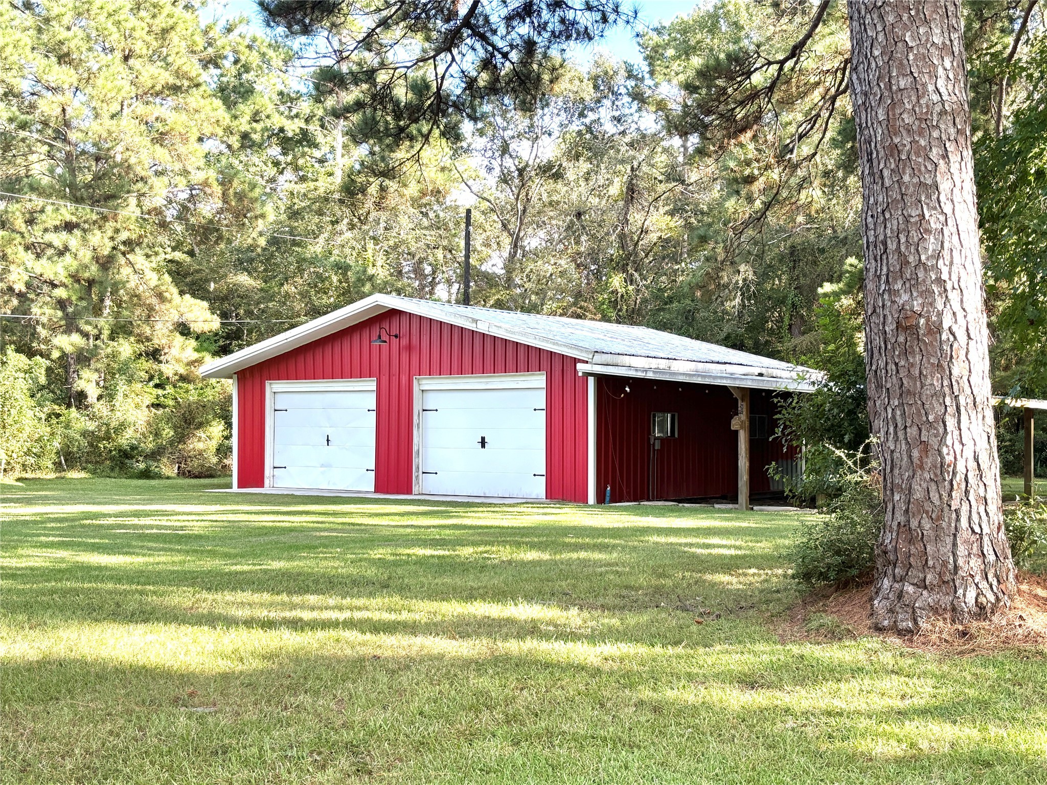 211 Garden West Conroe, TX 77304 - Photo 9 of 35 This property wouldn't be complete without the traditional little red barn.