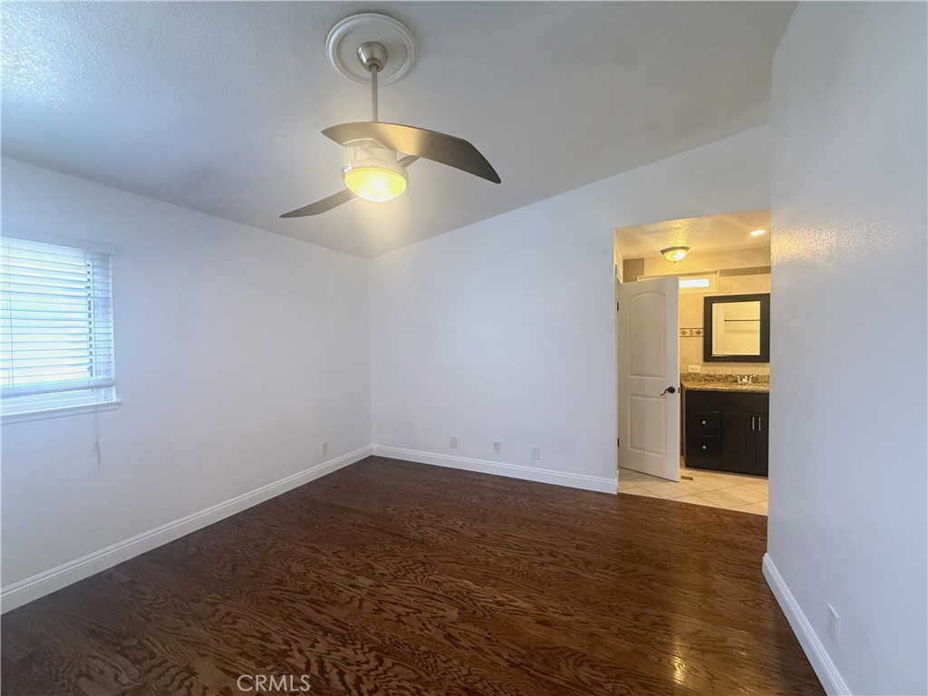977 Wellington Road San Dimas, CA 91773 - Photo 12 of 20 wooden floor in an empty room with a window