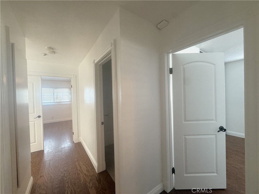 977 Wellington Road San Dimas, CA 91773 - Photo 7 of 20 a view of a hallway with wooden floor