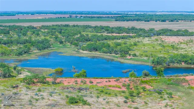 a view of a lake with a big yard