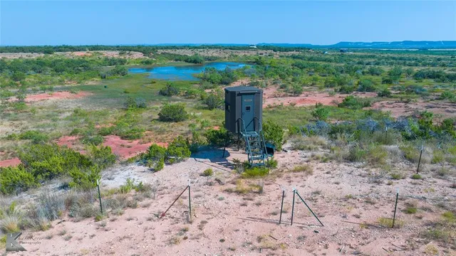 a view of a lake with a yard