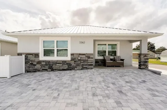 a view of a house with sitting area and furniture