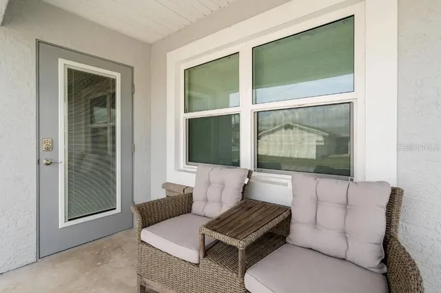 a living room with furniture and a window