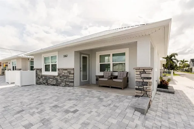 a view of living room filled with furniture and furniture