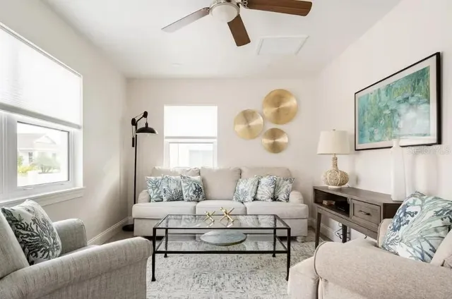 a living room with furniture and a window