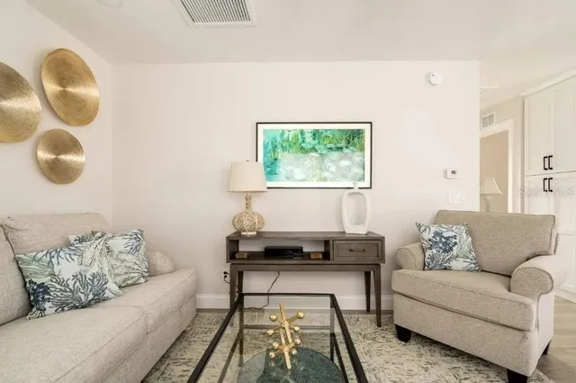 a living room with furniture and a window