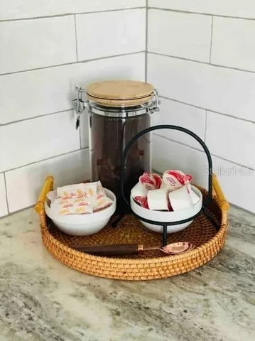 a view of a dining room with table and chairs