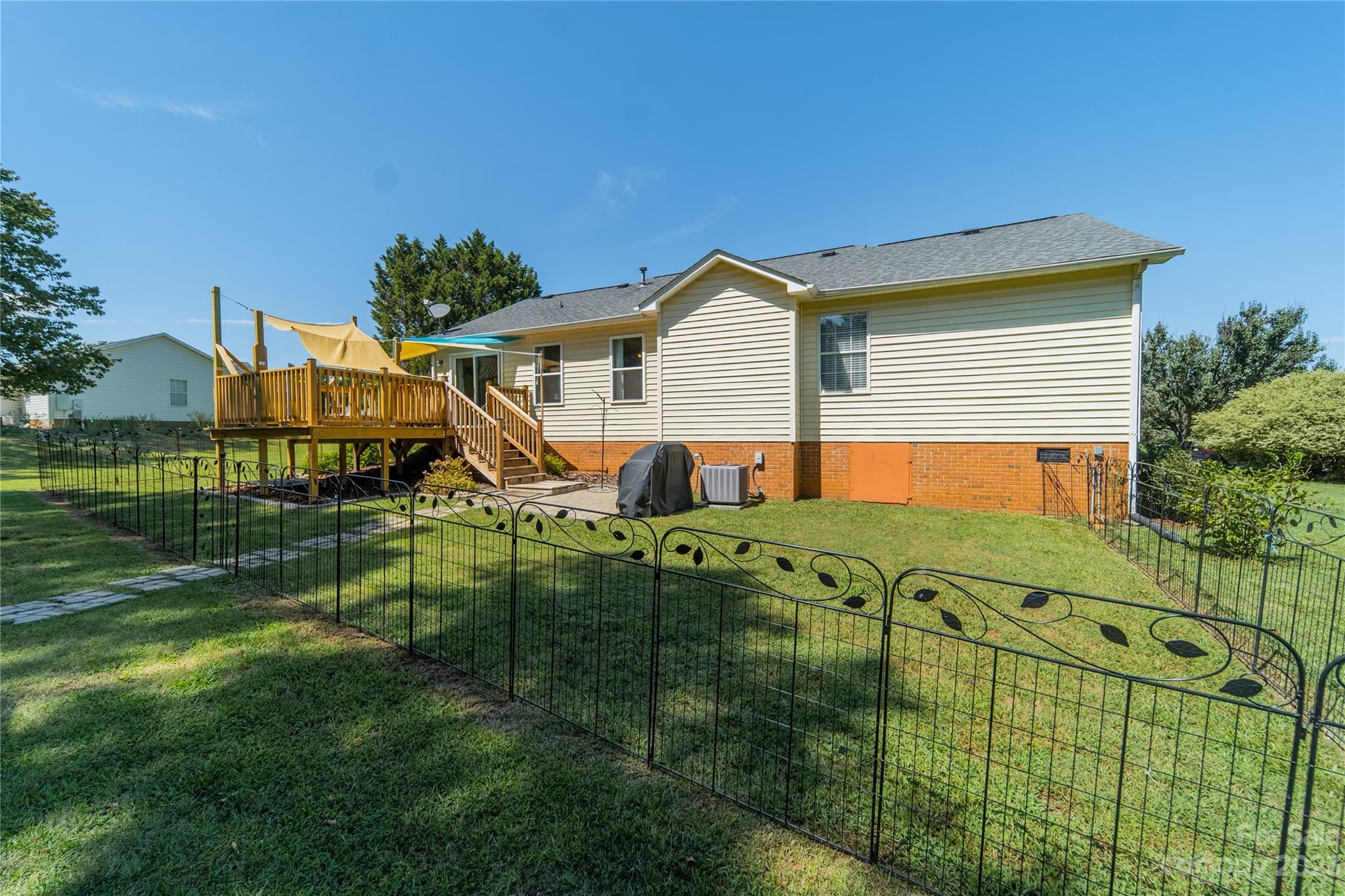 1585 Wimbleton Woods Drive Fort Mill, SC 29708 - Photo 11 of 41 a view of a house with a backyard