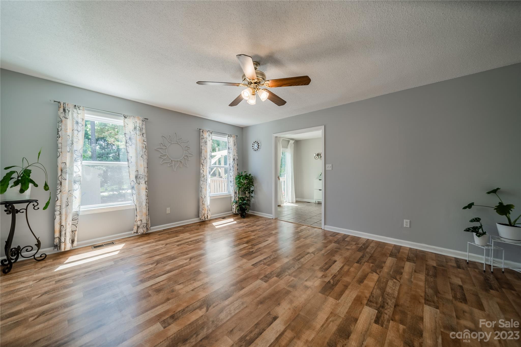 1585 Wimbleton Woods Drive Fort Mill, SC 29708 - Photo 13 of 41 an empty room with wooden floor and windows