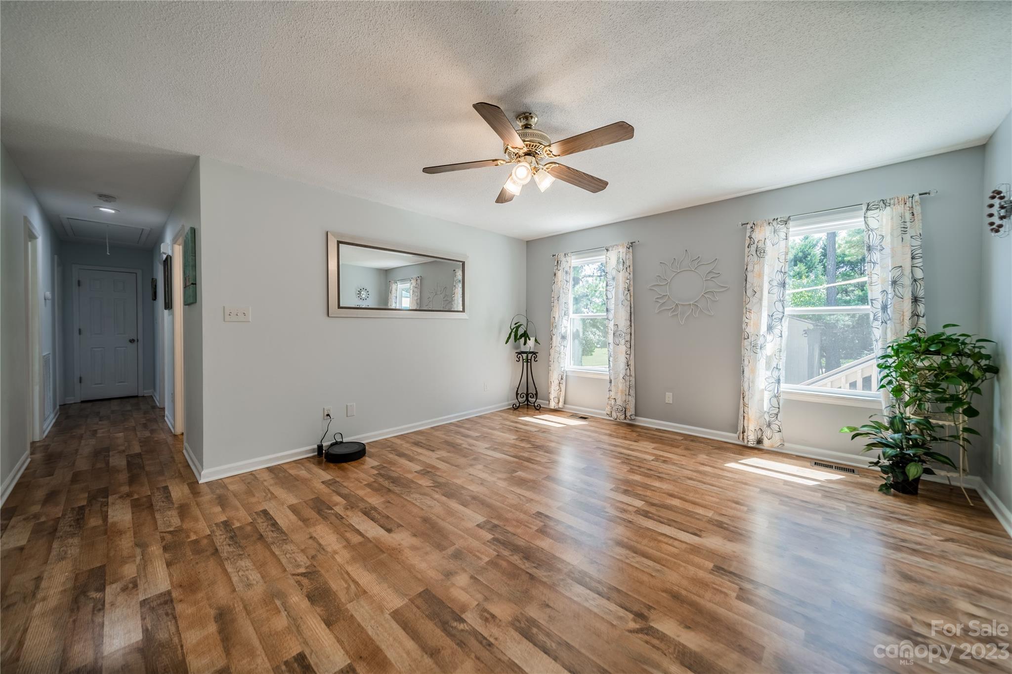 1585 Wimbleton Woods Drive Fort Mill, SC 29708 - Photo 14 of 41 a view of an empty room with a window and wooden floor